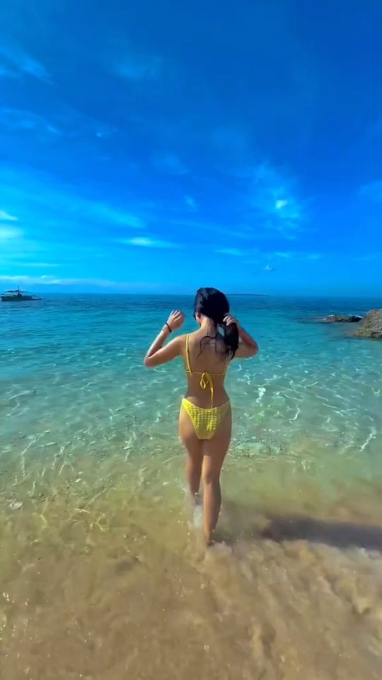 Turquoise water and golden sand of the private beach at Dasol Beach Villas, Pangasinan
